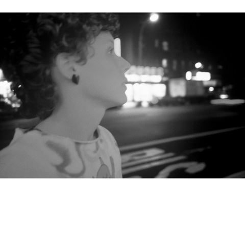 close up black and white photo of the artist Jane Dickson on the street in profile looking away