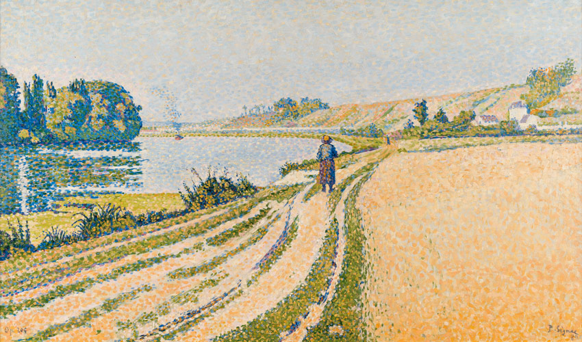 landscape view of pond and a wheat field with a figure walking on the road in between them