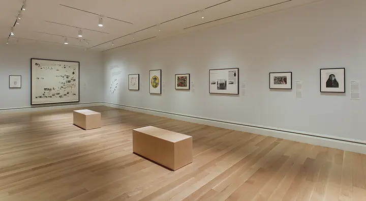 photo of gallery interior showing works on paper