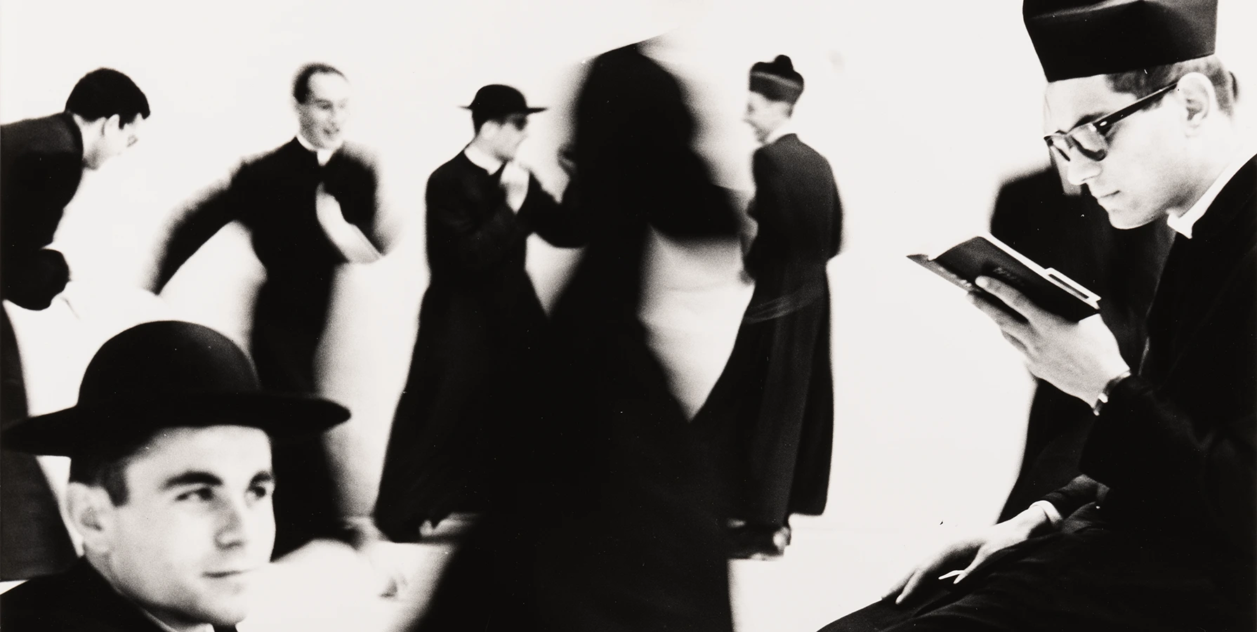 high contrast black and white image of priests