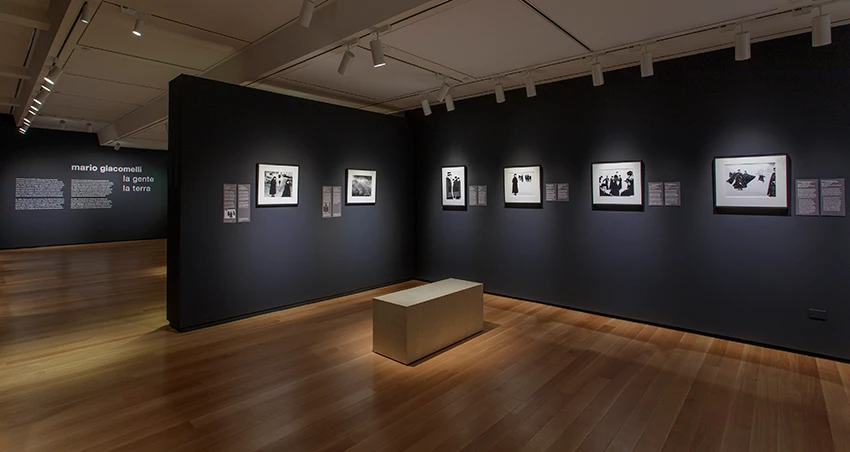 dark gallery with photos on the wall