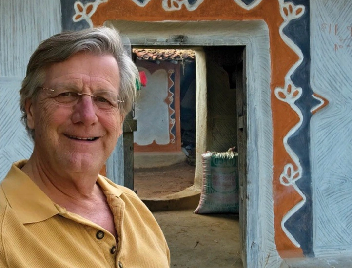 photo of the author and event subject against a row of ornate Indian doorways
