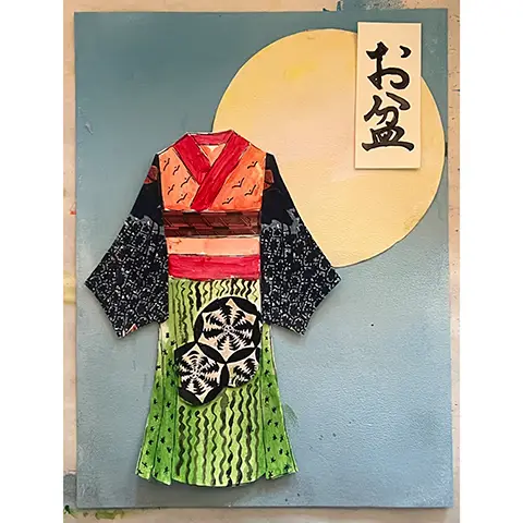 photo of arts and crafts work on paper featuring a Japanese style dress against a blue background with a yellow moon and Japanese characters in the top right