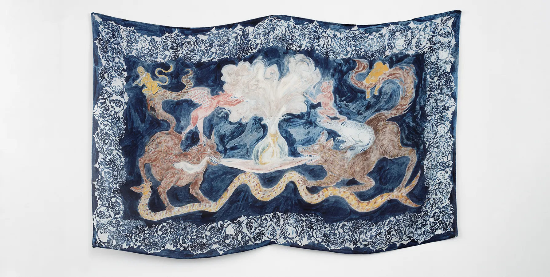 photo of a silk tapestry featuring figures on indigo