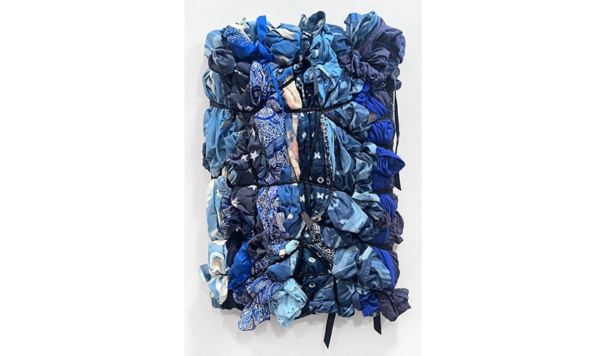 photo of bound blue and indigo colored fabrics