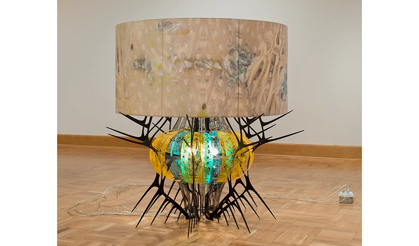 A sea-urchin shape has been turned into a giant table lamp with a shade