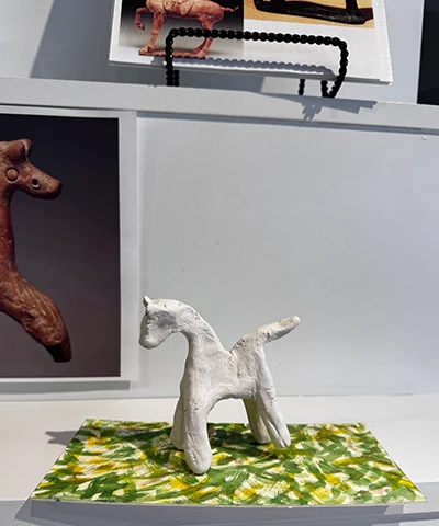 crafted prototype of clay horse figurine on a base