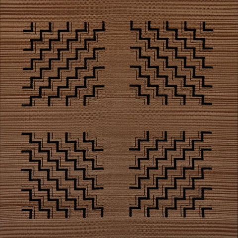 square brown textile with darker lines in a quadrant formation