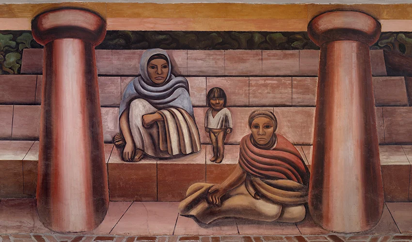 detail of a mural depicting two seated women, and one standing infant, seemingly at the base of exterior steps and flanked by two columns.