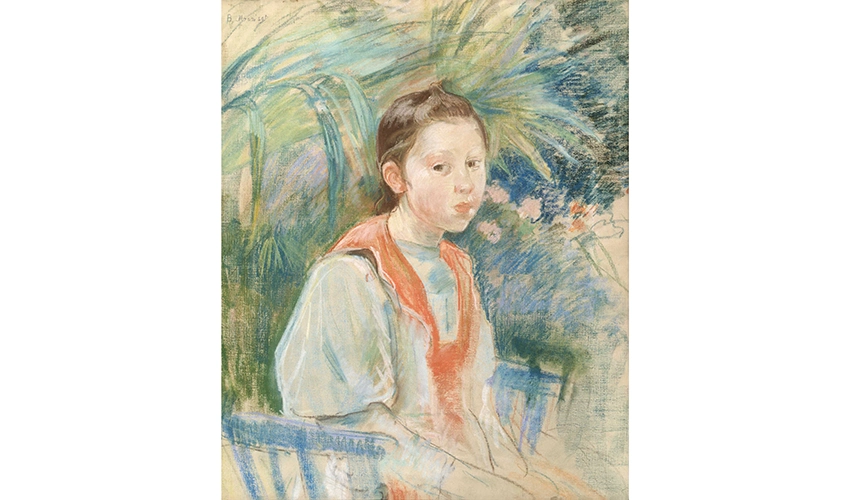 Portrait of a pale young girl with dark hair sitting in front of a floral background looking at the viewer.