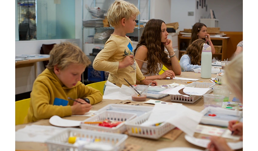young people crafting at a table