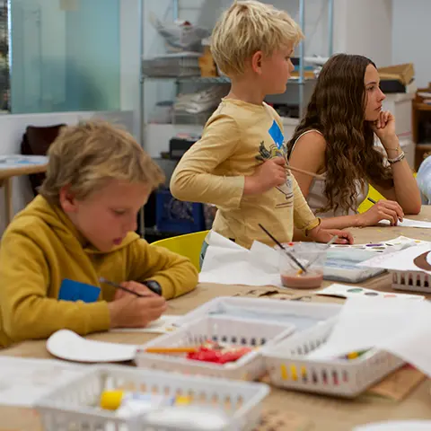 young people crafting at a table 
