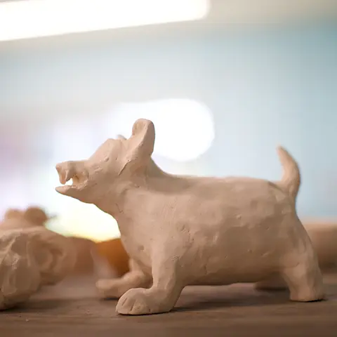 closeup photo of a carved animal, possibly a dog
