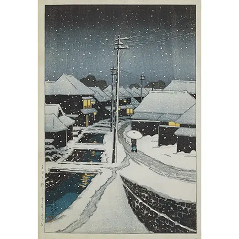 snowy street scene of early 20th century Tokyo at night with a figure walking down a path near a waterway and past some buildings lit from the inside