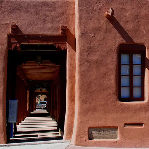 photo of exterior of adobe style building