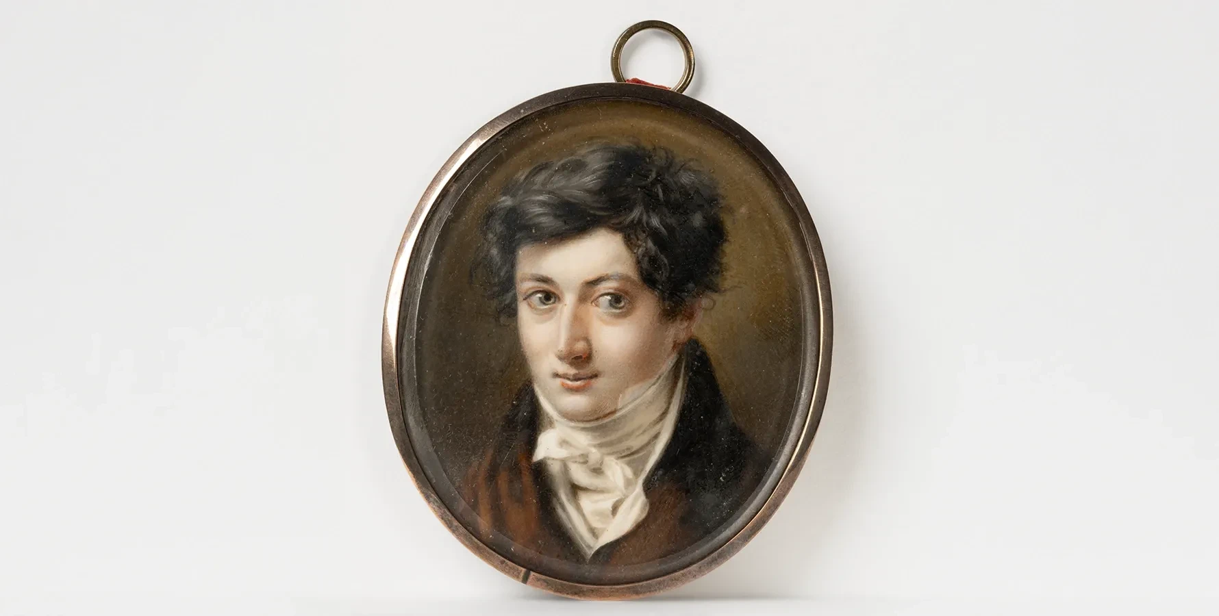 photo of a portrait miniature of a young gentlemen wearing timely garb of the 1830s