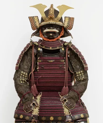photo detail of a Japanese suit of armor against an off white backdrop