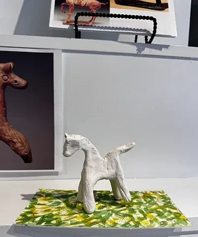 crafted prototype of clay horse figurine on a base