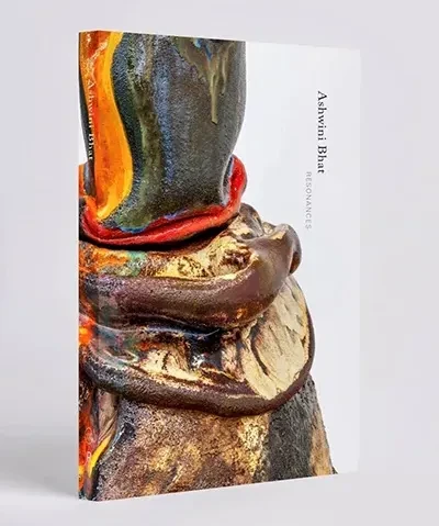 photo of a book entitled Resonances featuring an abstract detail of a sculpture on the cover