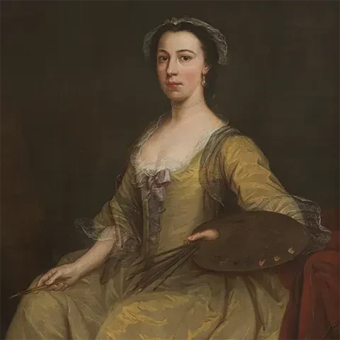 portrait of a person, presumably a woman, sitting on a couch against a yellow wall with a window, staring at the viewer