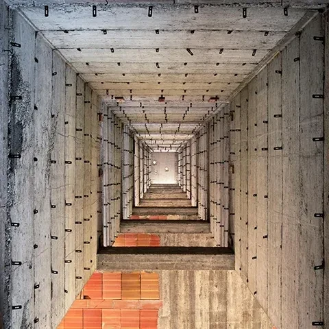 square photo of disorienting view of building interior
