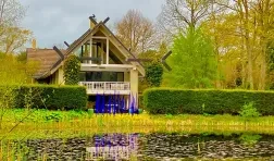 photo of exterior with pond in foreground