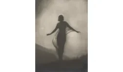 black and white photo featuring a silhouette of a figure, presumably a woman, with their arms raised slightly standing outdoors