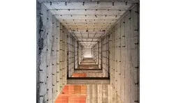 square photo of disorienting view of building interior